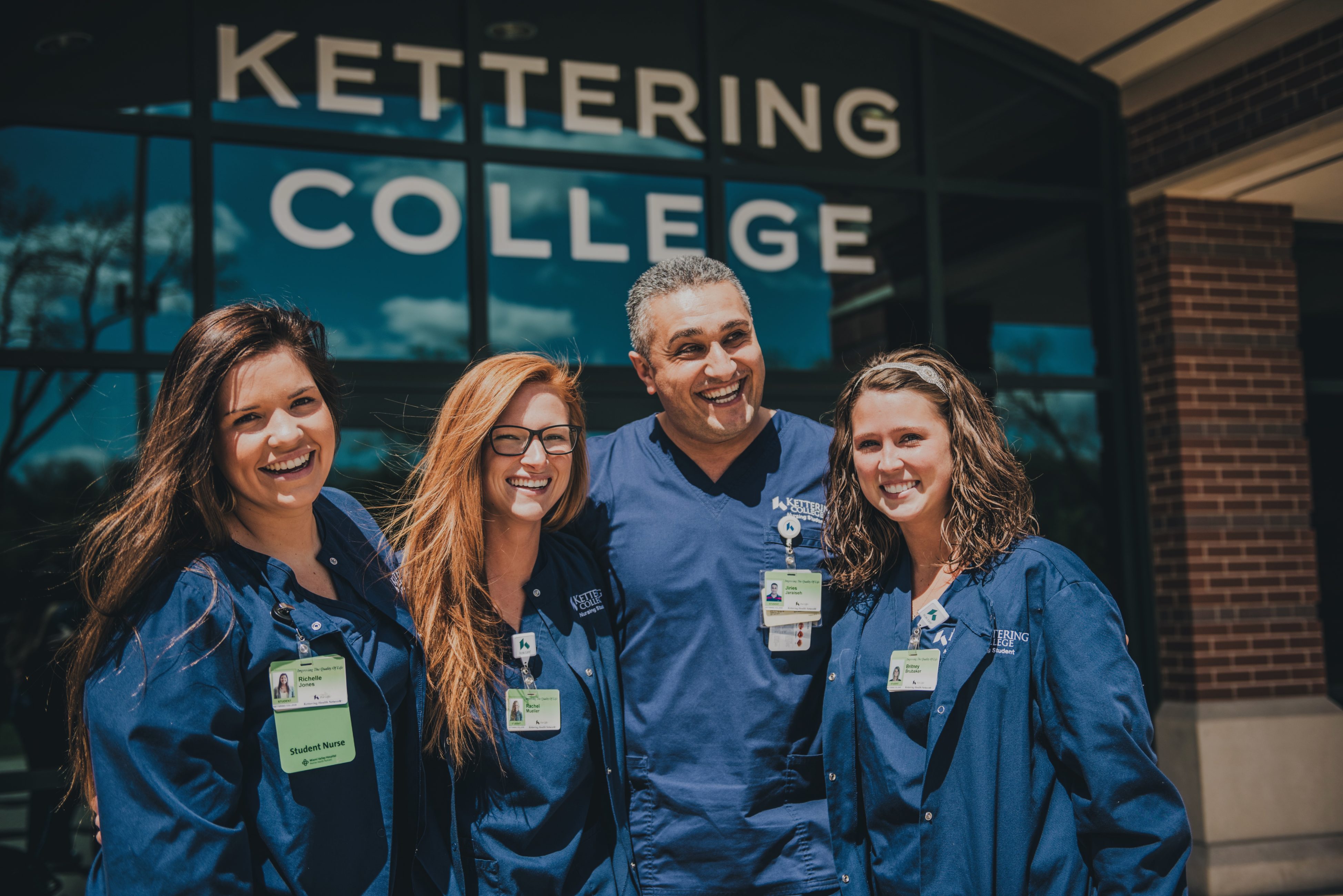 nursing students in their blue scrubs in front of Kettering College