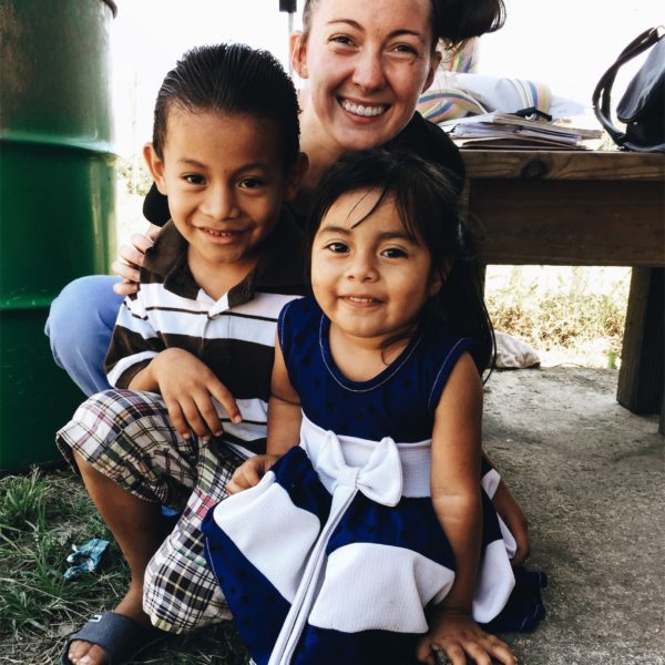 Emily, an occupational therapy student from Kettering College, poses with two children from Belize during last years mission trip. 